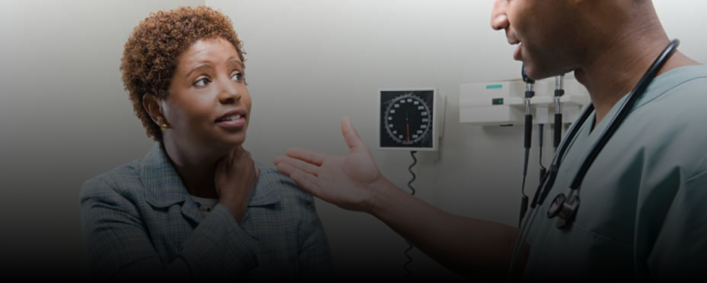 The doctor is talking to her patient in a medical office