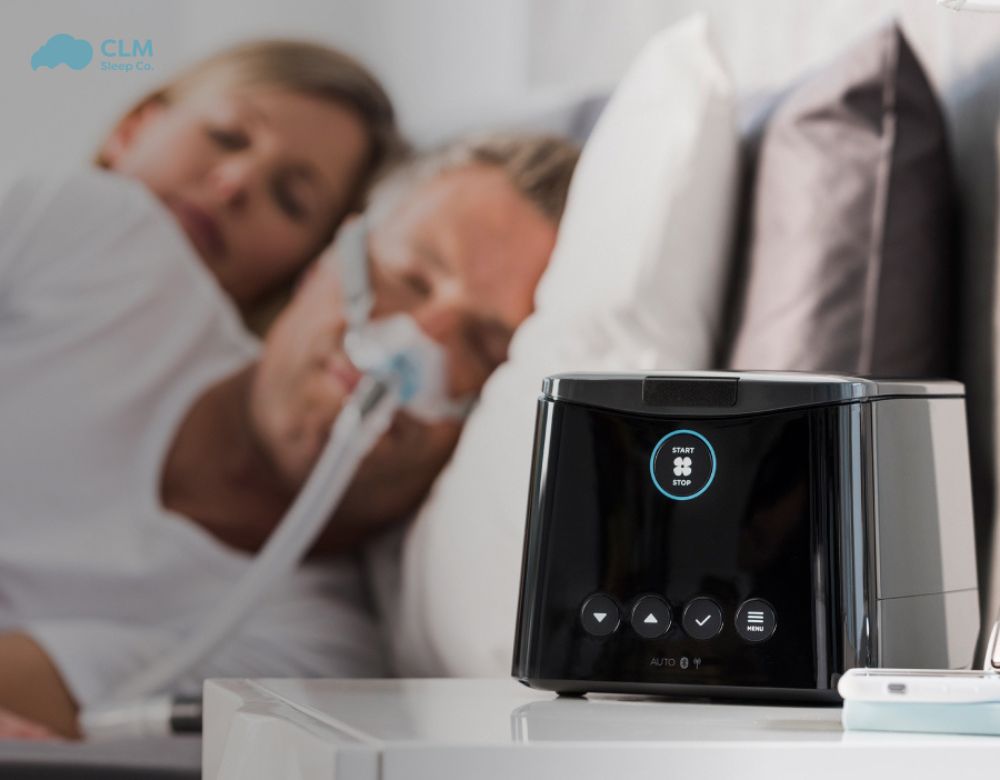 The man uses a Fisher & Paykel CPAP machine to treat his sleep apnea.The man uses a Fisher & Paykel CPAP machine to treat his sleep apnea